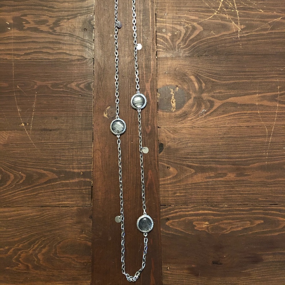 Long silver necklace with gray stones